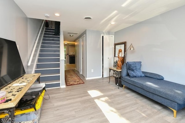 sitting room featuring light hardwood / wood-style flooring