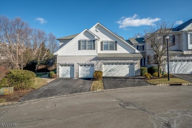 front of property with a garage