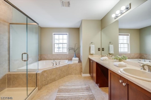 bathroom featuring a wealth of natural light, tile patterned flooring, separate shower and tub, and vanity