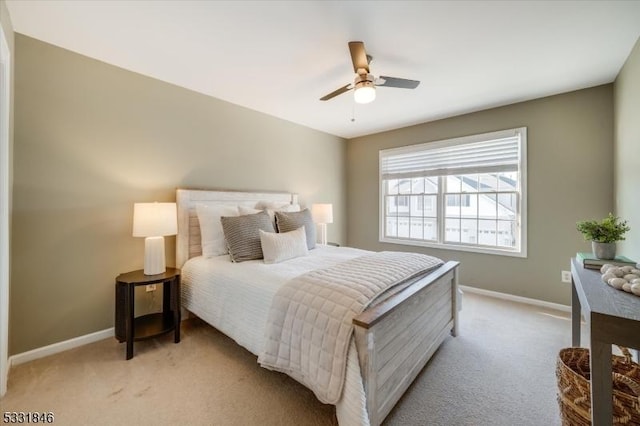 bedroom with light carpet and ceiling fan