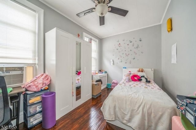 bedroom with ceiling fan, cooling unit, dark hardwood / wood-style flooring, and crown molding