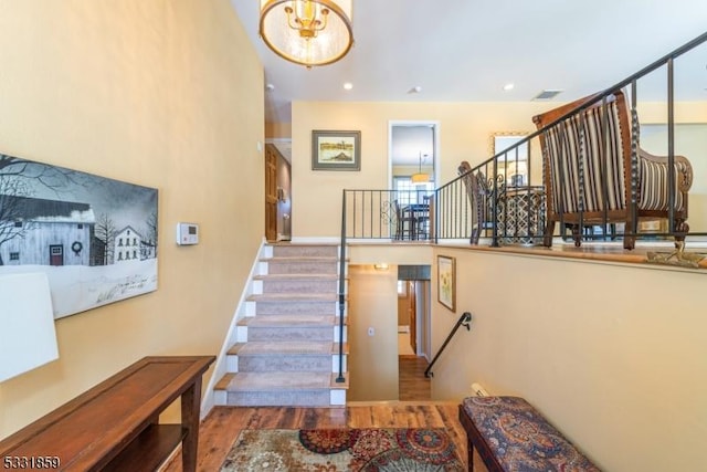 stairway featuring wood-type flooring