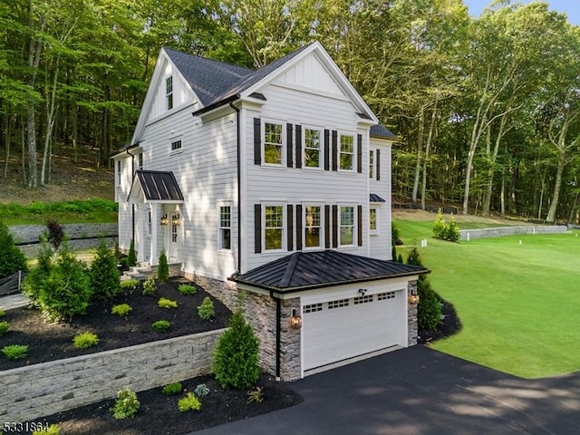 view of front facade featuring a front yard and a garage