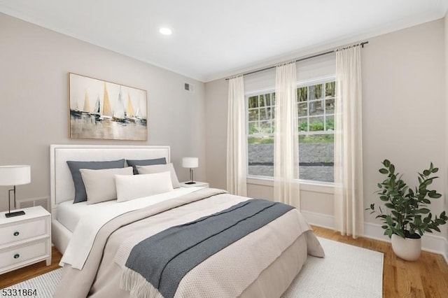 bedroom featuring light hardwood / wood-style floors