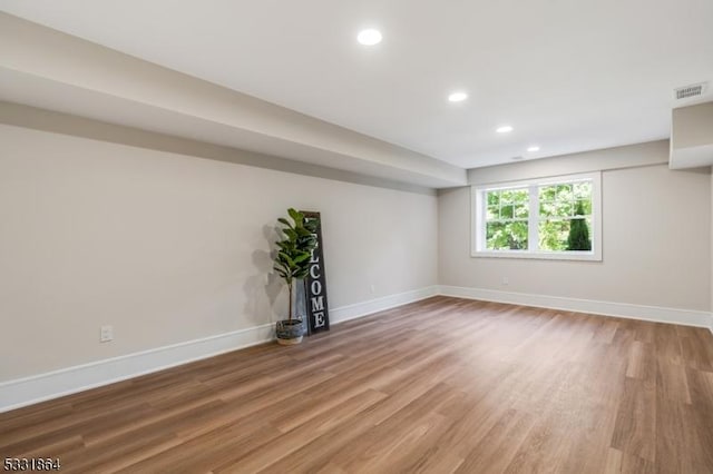 basement featuring hardwood / wood-style flooring