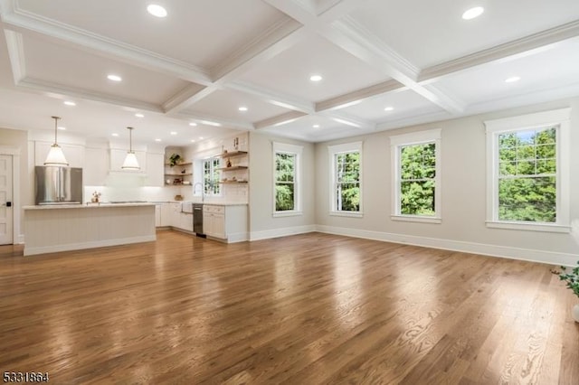 unfurnished living room featuring dark wood-type flooring, beamed ceiling, and coffered ceiling