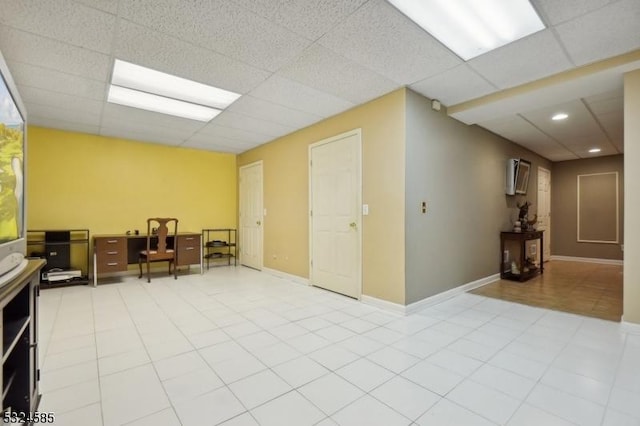 spare room featuring a paneled ceiling