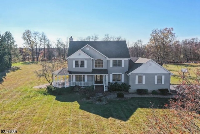 view of front of home featuring a porch and a front lawn