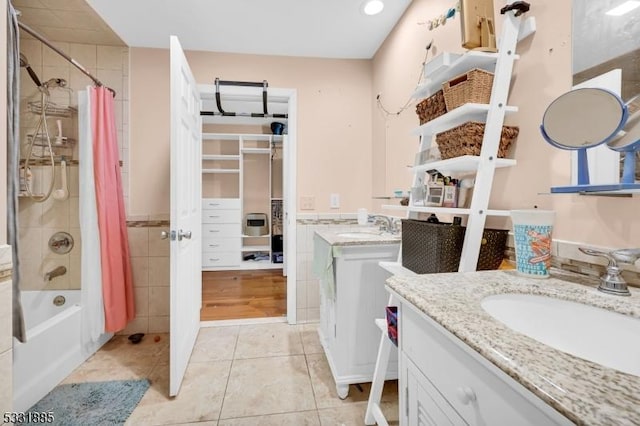 bathroom with shower / tub combo, vanity, and tile patterned floors