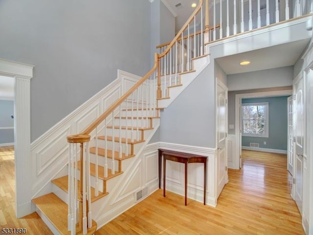 staircase with wood-type flooring