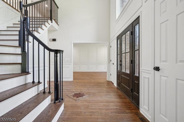 foyer entrance with dark hardwood / wood-style flooring and french doors