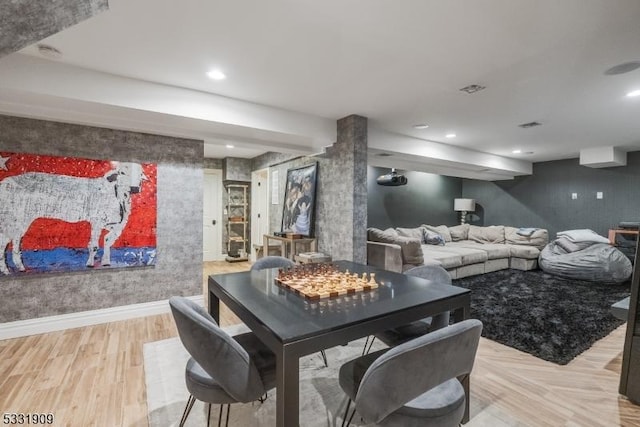 dining space featuring light wood-type flooring