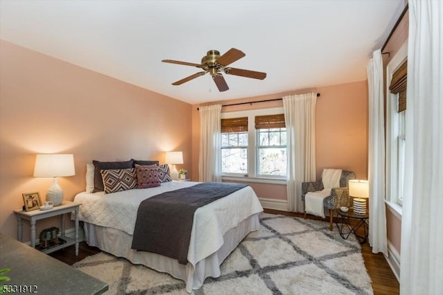 bedroom featuring wood-type flooring and ceiling fan