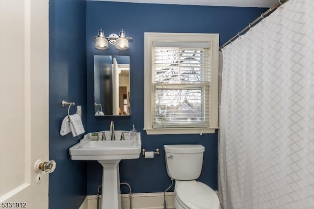 bathroom featuring toilet and sink