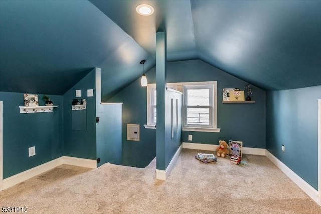 interior space with lofted ceiling and carpet