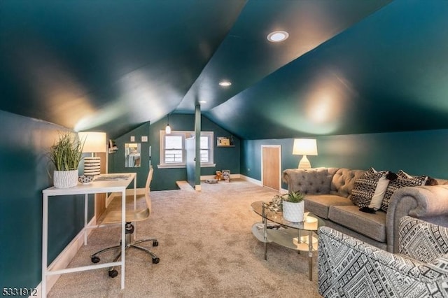 carpeted home theater room featuring vaulted ceiling