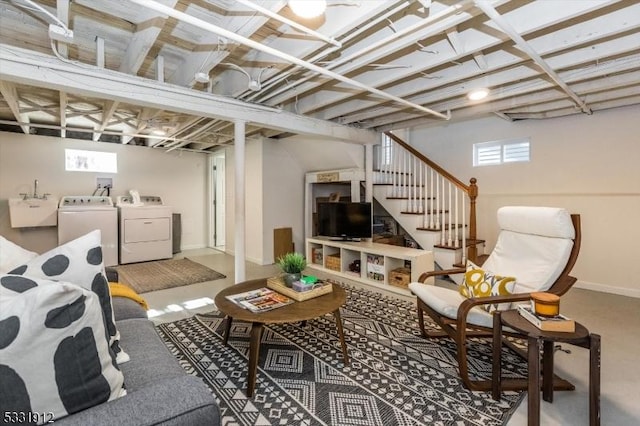 basement featuring separate washer and dryer and sink