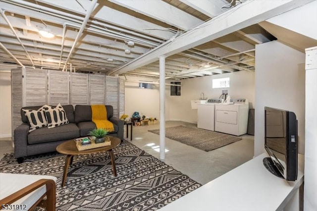 basement with washer and clothes dryer