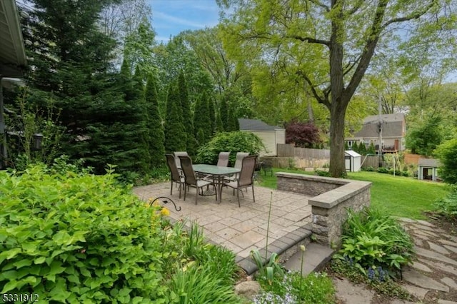 view of patio / terrace with a storage unit