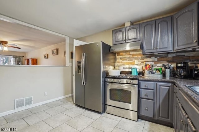 kitchen with ceiling fan, light tile patterned floors, stainless steel appliances, and tasteful backsplash