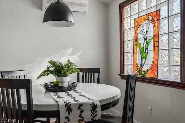 dining room with a wall unit AC