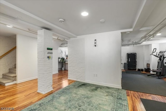 workout room with wood-type flooring