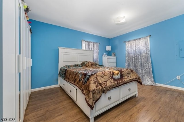 bedroom with hardwood / wood-style flooring