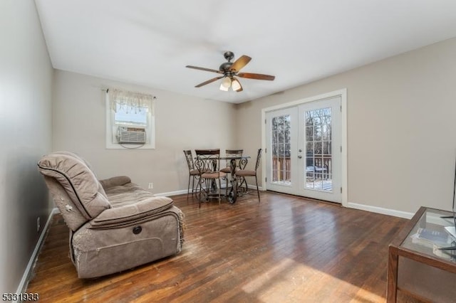 sitting room with ceiling fan, cooling unit, dark hardwood / wood-style flooring, and french doors