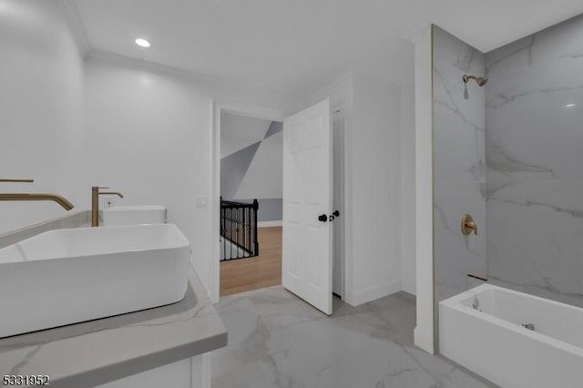 bathroom featuring sink and tiled shower / bath