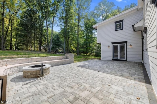 view of patio featuring an outdoor fire pit