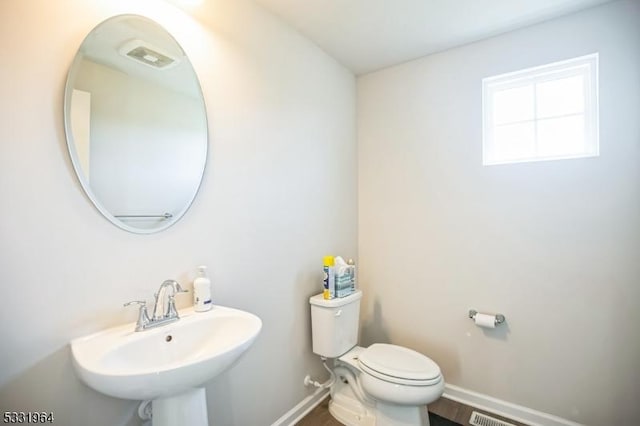 bathroom with toilet and sink