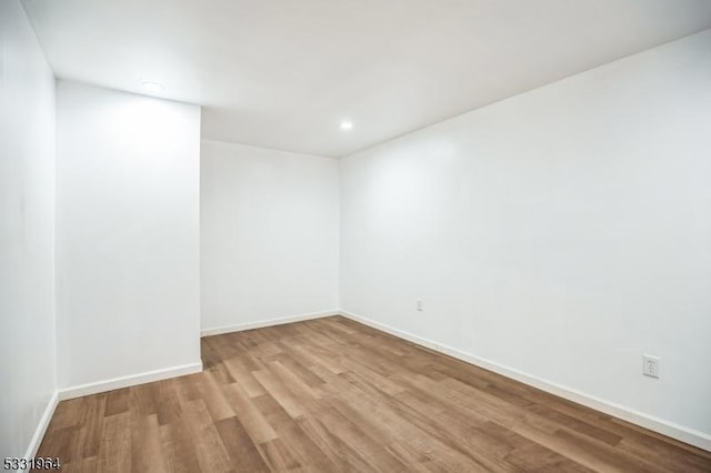 spare room featuring light hardwood / wood-style floors