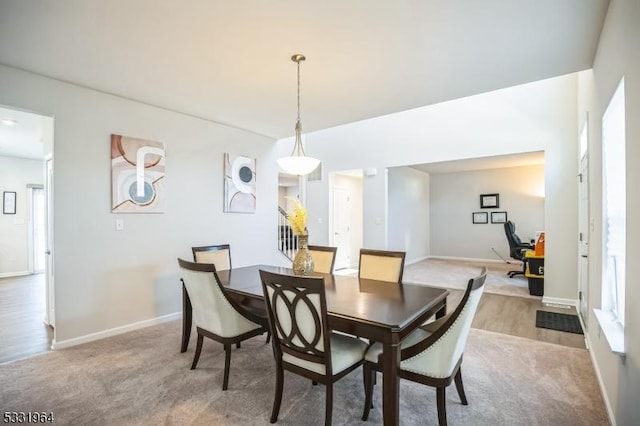 view of carpeted dining space