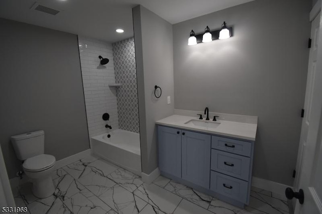 full bathroom featuring vanity, toilet, and tiled shower / bath combo