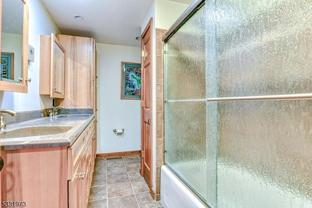 bathroom with enclosed tub / shower combo and vanity