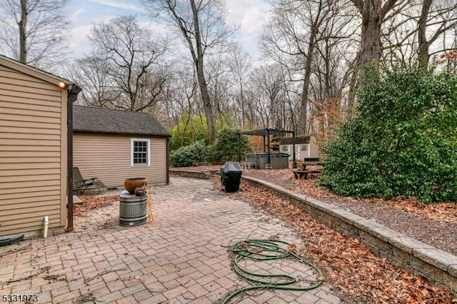 view of patio with a hot tub