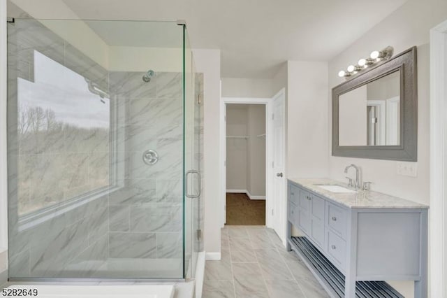 bathroom with vanity and an enclosed shower