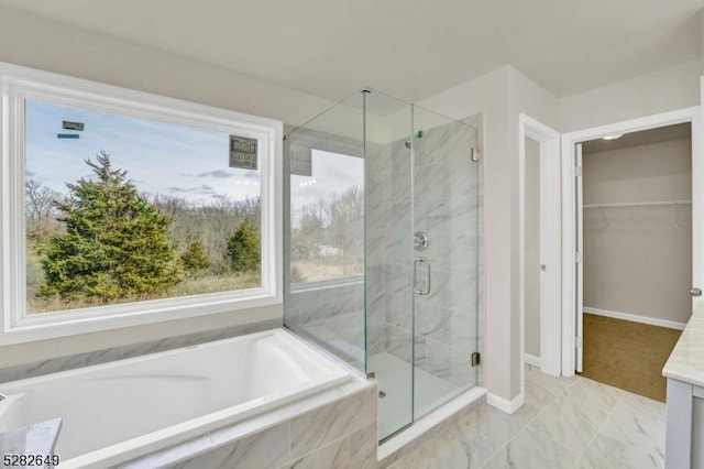 bathroom with vanity and separate shower and tub