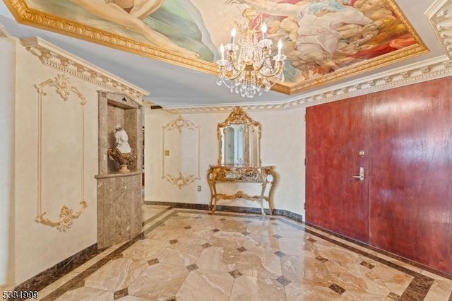 entryway featuring crown molding and a tray ceiling