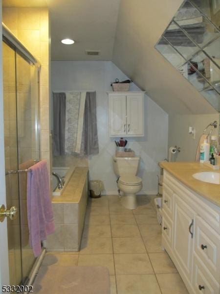 full bathroom featuring tile patterned floors, separate shower and tub, vanity, and toilet