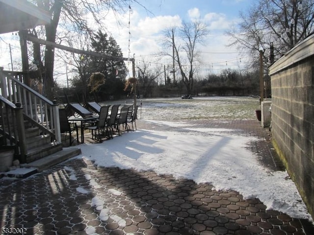 view of yard layered in snow