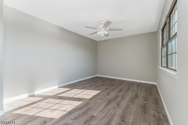 spare room featuring ceiling fan and wood-type flooring