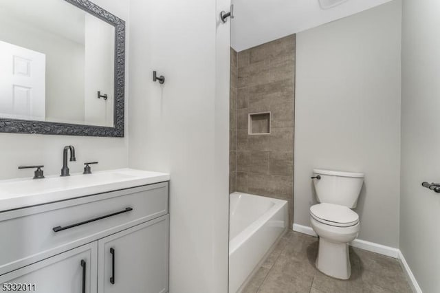 full bathroom featuring toilet, tile patterned flooring, tiled shower / bath combo, and vanity