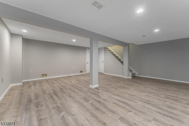 basement featuring light hardwood / wood-style flooring