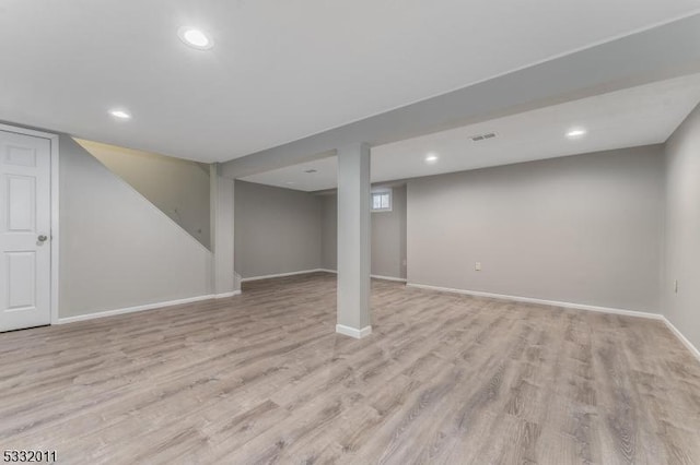 basement featuring light hardwood / wood-style flooring