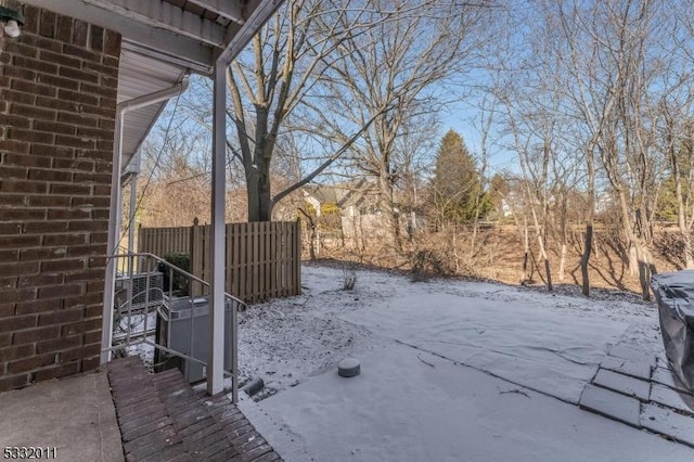 view of yard layered in snow