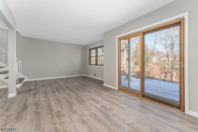 unfurnished living room featuring light hardwood / wood-style flooring