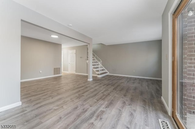 unfurnished living room with hardwood / wood-style floors