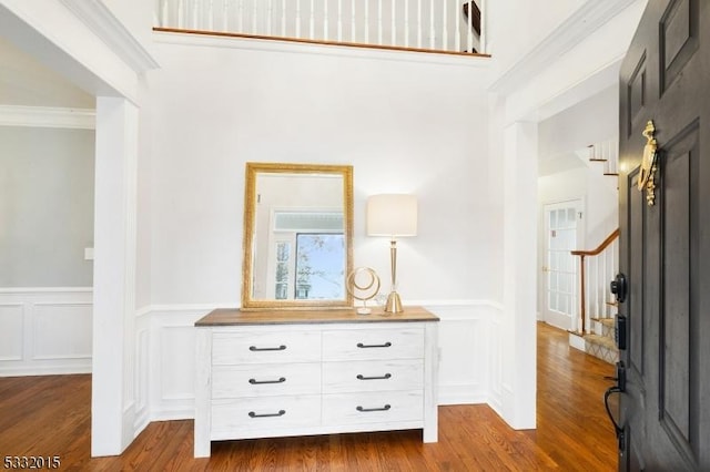 interior space featuring dark hardwood / wood-style floors and crown molding