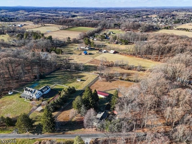 birds eye view of property with a rural view